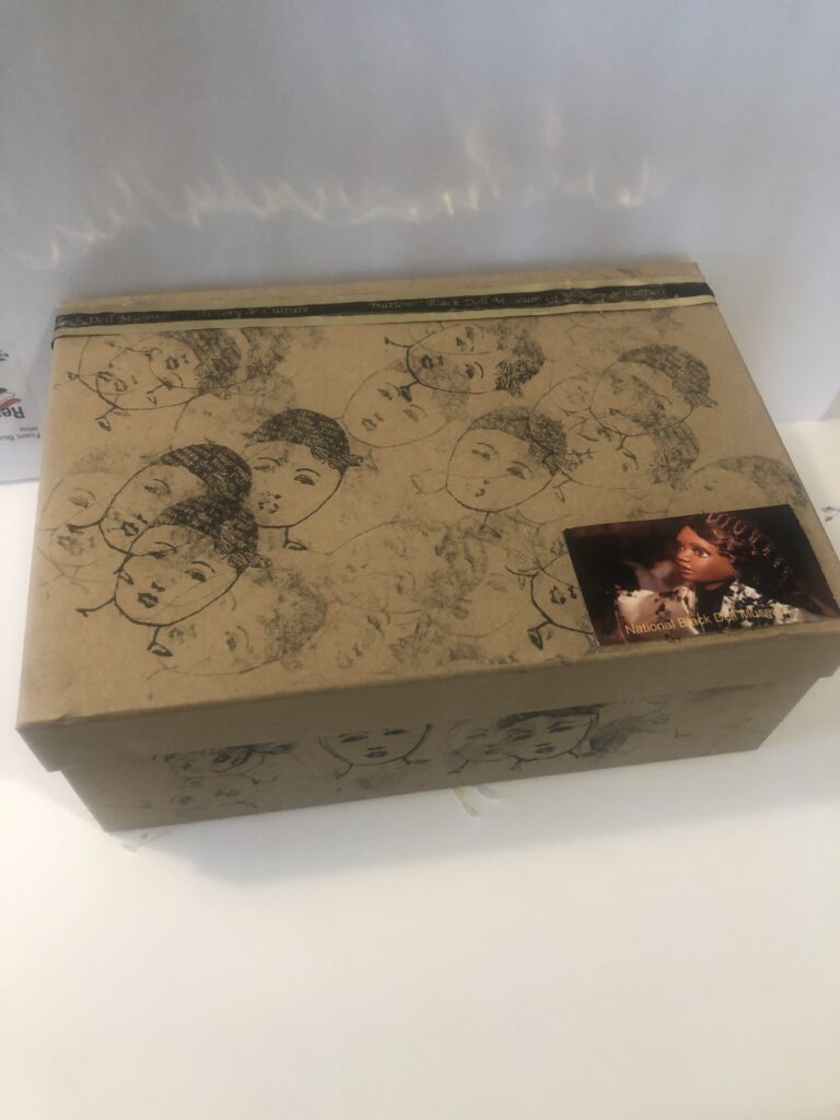 Decorative cardboard box with sketched faces