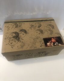 Decorative cardboard box with sketched faces