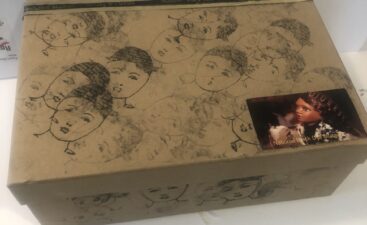 Decorative cardboard box with sketched faces Decorative cardboard box with sketched faces
