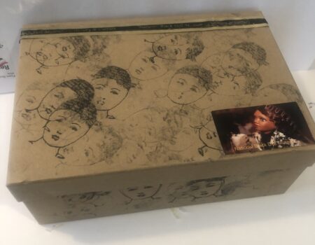 Decorative cardboard box with sketched faces Decorative cardboard box with sketched faces