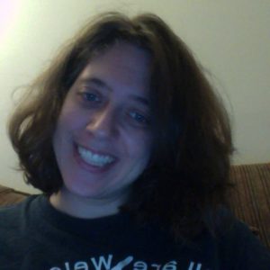 Smiling woman with shoulder-length dark brown hair