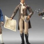 Toy historical figure holding map and paper
