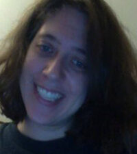 Smiling woman with shoulder-length brown hair Smiling woman with shoulder-length brown hair