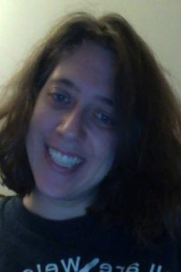 Smiling woman with shoulder-length brown hair Smiling woman with shoulder-length brown hair