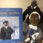 Book and two historical plush dolls