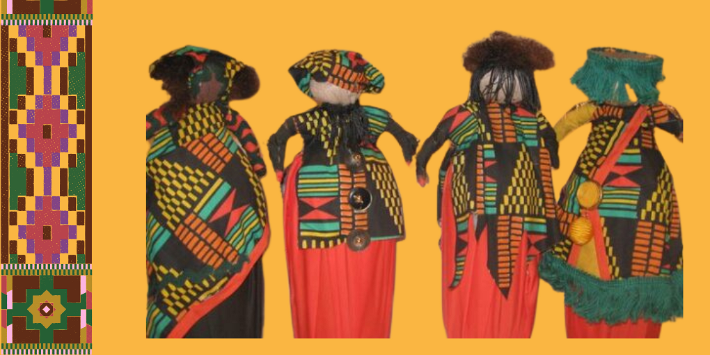 Four dolls wearing colorful Kente patterned clothing